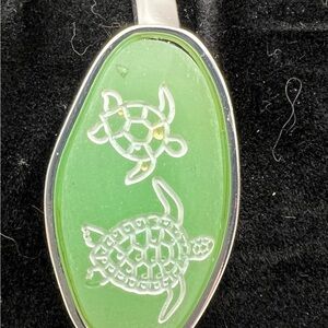 Green Silver Tone Stretch Bracelet with White Sea turtles.